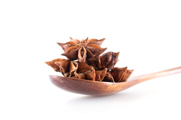 Star anise in a wooden spoon