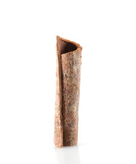 A piece of cinnamon on white background
