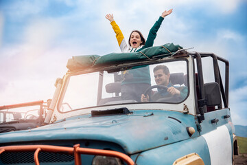 Happy man and woman travel by car in cabriolet to sea. Concept summer trip family vacation, realize dream © Parilov