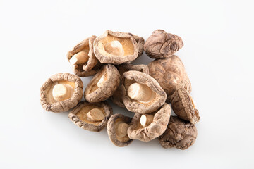 Dried shiitake mushrooms on white background