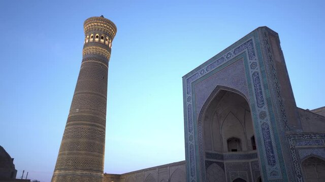Illuminated Kalan Mosque Against Clear Sky - Bukhara, Uzbekistan