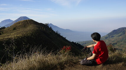 person on the top of the mountain