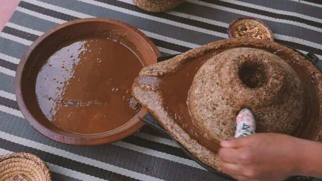 Traditional Moroccan millstone, grinding stone, where Argan kernels are ground. The paste will be used to extract the famous Argan oil. 