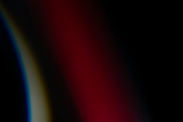 crystal light leak effect for photo overlay. prism lens flare bokeh abstract with glow, colorful, and magical lights on black background.