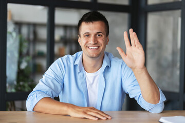 Head shot portrait guy makes video call looks at camera and smiling, Young happy man shows gesture...