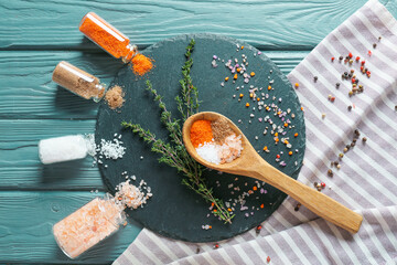 Composition with different salt, herbs and spices on color wooden background - Powered by Adobe