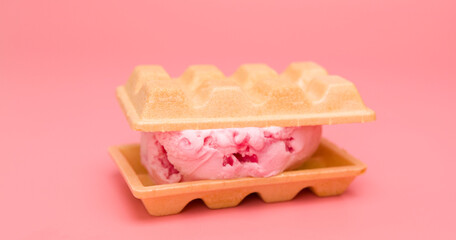 Waffles stuffed with ice cream strawberry isolated on pink background, Front view Food concept.
