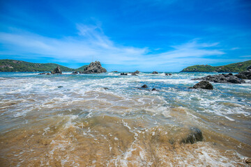 Beautiful beach at famous beach, rock, sun, water and island