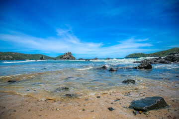 Beautiful beach at famous beach, rock, sun, water and island