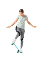 Sporty young woman with skateboard on white background