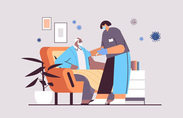 female doctor in mask vaccinating senior man patient fight against coronavirus vaccine development concept