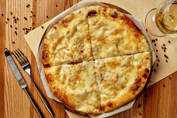 Megrelian khachapuri with melted sulguni cheese with wine