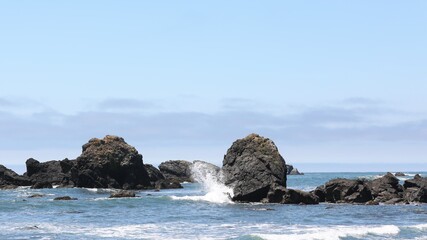 Fototapeta na wymiar Rocks and Waves Off the Beach at Crescent City, California