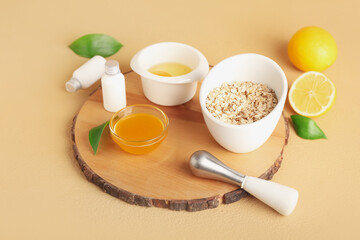 Natural ingredients for homemade cosmetics on color background