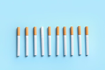 Many cigarettes on color background