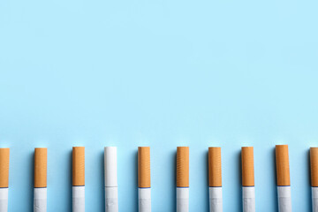 Many cigarettes on color background