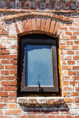 Red brick wall with modern window