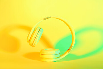 Modern headphones on color background