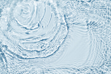 Water spills on a light blue background. Natural sunlight and shade. Beautiful burst. Summer mood....