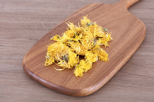 Chrysanthemum tea on cutting board