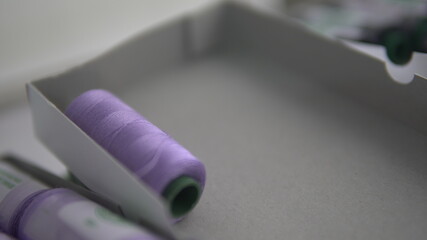 sewing thread purple background