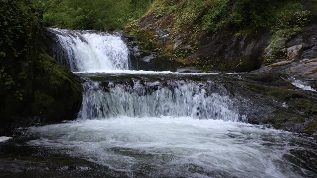 Beautiful relaxing view of waterfall at Sweet Creek in Oregon in the wilderness.
