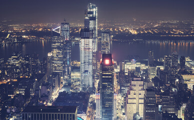Manhattan hazy skyline at night, New York City, USA.