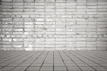 Empty room with bricks wall and tiled floor.