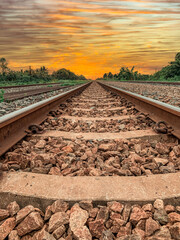 The train tracks stretching into the sunset