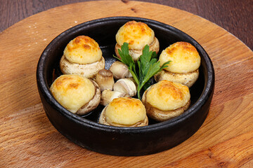 Baked champignon staffed with cheese