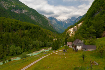 Fototapeta premium Traditional house in soca valley Slovenia. Amazing view about the Soca valley in Triglav national park Slovenia.