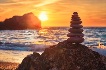 Fototapeta na wymiar Concept of balance and harmony - stone stack on the beach