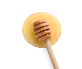 Wooden dipper and spilled honey on white background