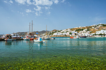 Fototapeta na wymiar Mykonos port with fishing boats and yachts and vessels, Greece