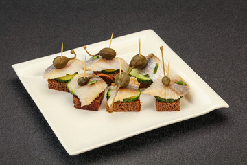 Herring fillet canape with caperberry