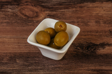 Green pickled olives in the bowl