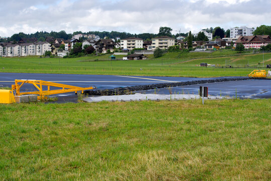 Deactivated safety net at air base Emmen because of incoming traffic on runway on a cloudy summer day. Photo taken June 22nd, 2021, Emmen, Switzerland.