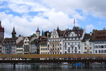Medieval old town of Lucerne with famous Kappelbrücke (Chapel Bridge) on a cloudy summer day with...