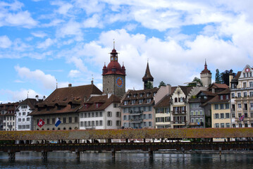 Fototapeta na wymiar Medieval old town of Lucerne with famous Kappelbrücke (Chapel Bridge) on a cloudy summer day with river Reuss. Photo taken June 22nd, 2021, Luzern, Switzerland.