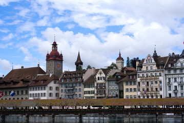 Medieval old town of Lucerne with famous Kappelbrücke (Chapel Bridge) on a cloudy summer day with river Reuss. Photo taken June 22nd, 2021, Luzern, Switzerland.