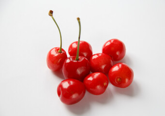  few berries of beautiful red ripe cherries on a white background. selective focus .High quality photo