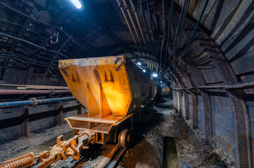 Underground mine. Underground railway for transporting ore. Mine trolley as part of an underground...