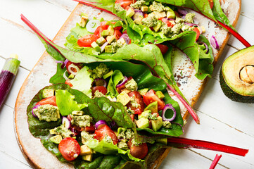 Spring vegetable salad in chard leaves,healthy salad