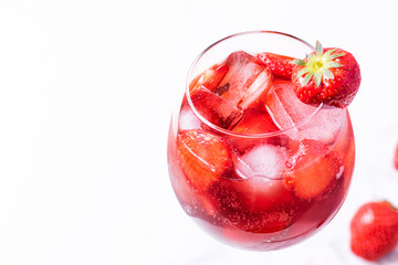Wine glass of strawberry alcohol aperol or daiquiri cocktail.
