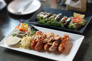 Grilled sausages on white plate