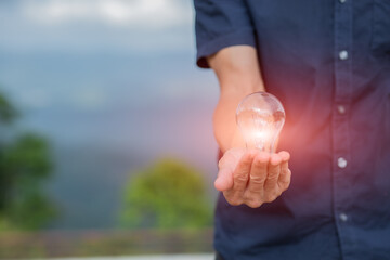 Light bulb Energy saving green nature background