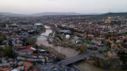 Aerial view of center of Tbilisi, bridge of peace over river Kura