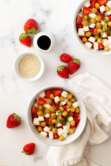 Strawberries, chickpeas and mozzarella cheese fresh salad
