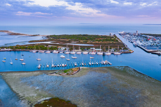 Aerial view of coastal marina at sunset
