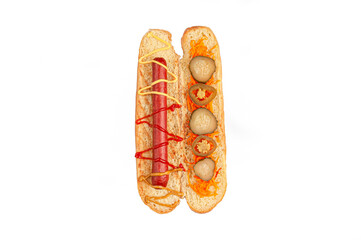 Hot dog ingredients. A cut bun contains the ingredients: sausage, sauce, pickled carrots and jalopno pepper. View from above. White background. Isolated.